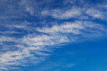 White clouds against the blue sky (background)
