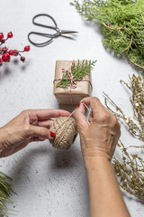 Graceful hands of the woman florist making bouquet of flowers