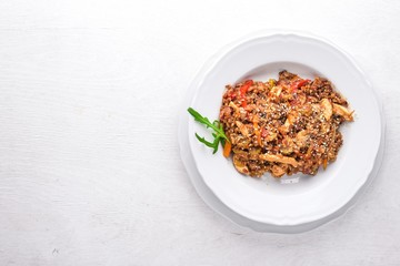 Chinese cuisine. Chicken fillet in tomato sauce on a wooden background. Top view. Free space for text.