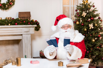 santa claus with tickets and passports