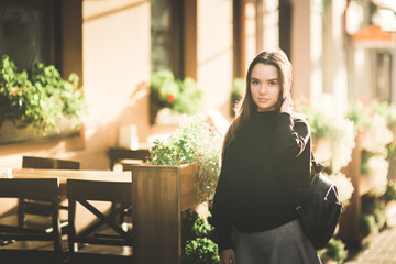 Beautiful young woman posing on the street in old city