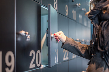 Woman opening a locker at the museum