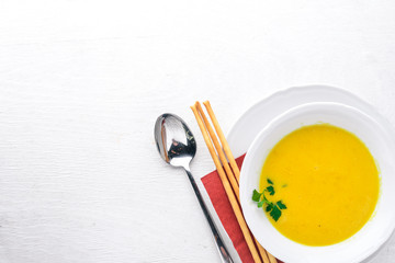 Corn soup. On a wooden background. Top view. Free space for text.