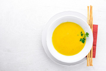 Corn soup. On a wooden background. Top view. Free space for text.