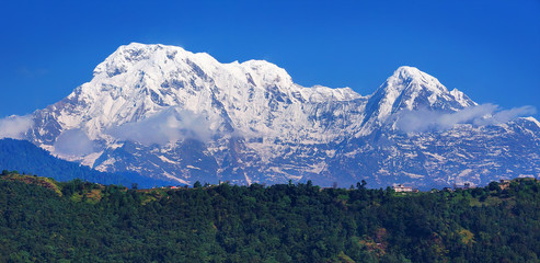 Horizontal Panoramic mountain view to  Mountain Annapurna I, or Main, and Annapurna South summits, Pokhara area, on Annapurna Circuit Trek, in Annapurna Himal, Himalaya Range, Nepal, Asia