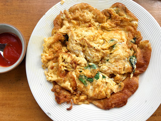 Thai omelette with basil leaf 