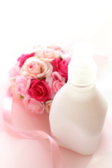 artificial rose bouquet and moisturiser  for beauty background image