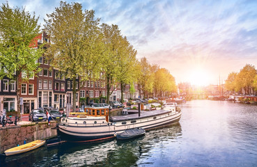 Fototapeta na wymiar Channel in Amsterdam Netherlands houses river Amstel landmark
