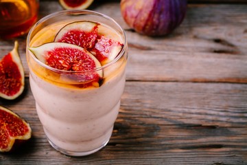 healthy breakfast smoothie with fresh figs and honey in glasses