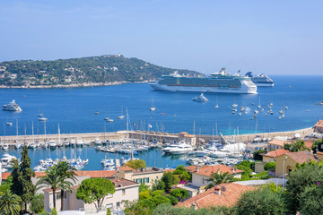 Fototapeta na wymiar Beautiful daylight view to boats and ships on water in Villefranche-sur-Mer, France.