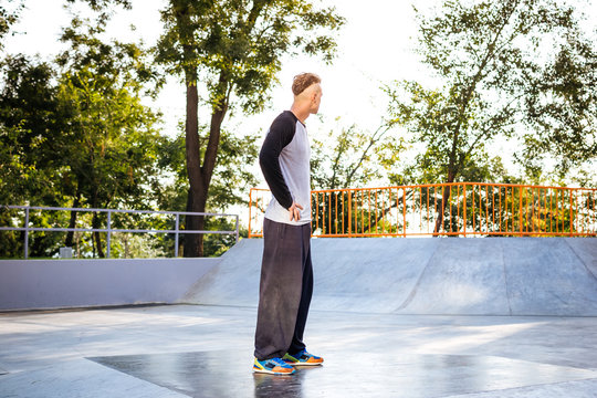 Young parkour man in skate park in the city
