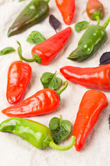 hot red and green peppers and basil closeup.