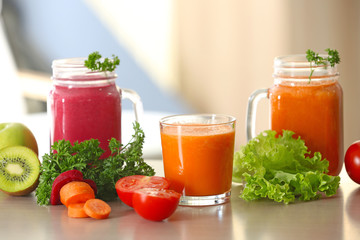 Fresh juices and ingredients on table