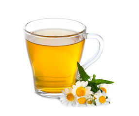 Cup of herbal tea with chamomile flowers and mint on white background