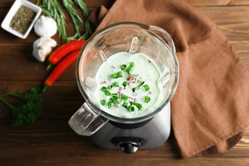 Creamy sauce for fish taco in blender on kitchen table