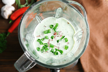 Creamy sauce for fish taco in blender on kitchen table