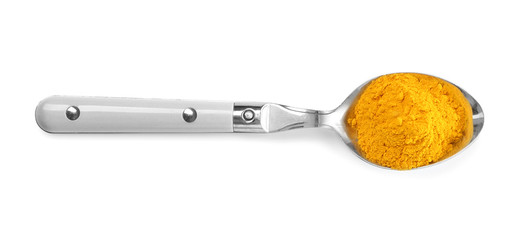 Turmeric in spoon on white background