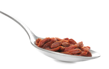 Spoon with dried goji berries on white background