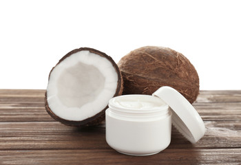 Coconut oil in jar on table against white background