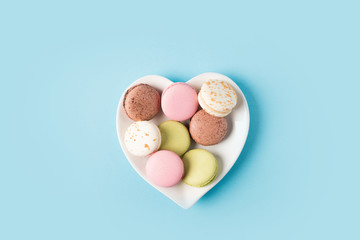 macarons on heart shaped plate