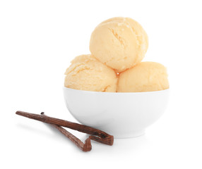 Bowl with delicious vanilla ice-cream balls on white background