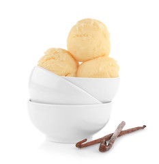 Bowls with delicious vanilla ice-cream balls on white background