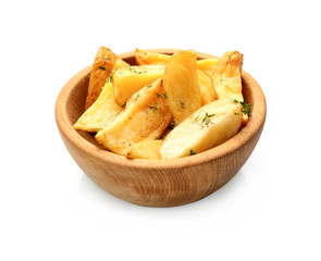 Bowl with delicious baked potato wedges on white background