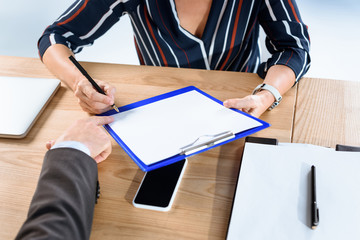 business partners writing contract