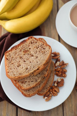 Sliced banana bread with nuts on plate