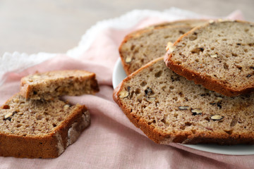 Sliced banana bread with nuts on plate