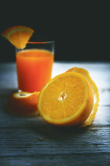 Fresh oranges isolated cut set on blue wooden base.