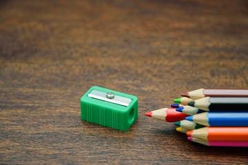 Color pencils with green sharpener on the wooden background, success concept, selective focus. - 171167476