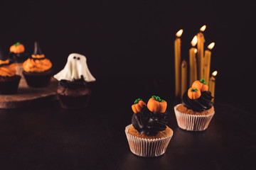 halloween cupcakes and burning candles