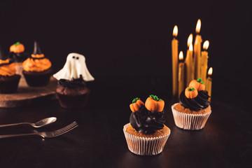 halloween cupcakes and burning candles