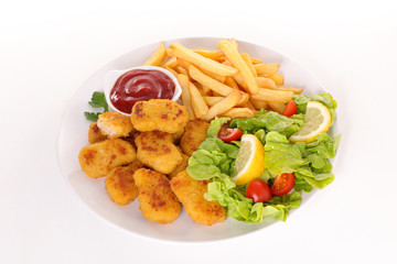 fried chicken nugget with french fries and salad
