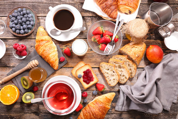 coffee cup,tea cup ,croissant and fruit