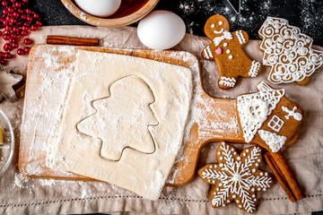 cooking christmas gingerbread on wooden background top view
