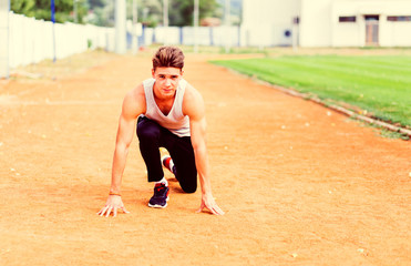 Young caucasian boy training outdoor. Sport and muscle concept