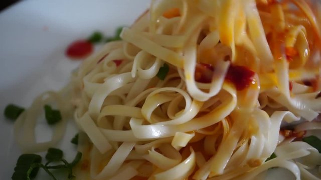 use chopsticks mix chili sauce in clear noodle, Malaysian chinese food
