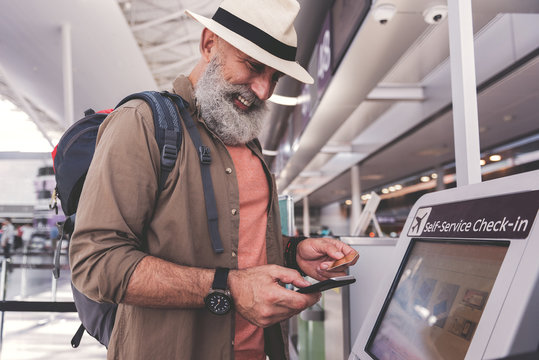 Outgoing happy pensioner typing in phone