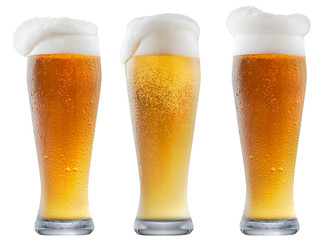 Mug of frosty light beer with foam isolated on a white background