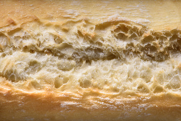 Crust, french baguette texture close up, bakery background.