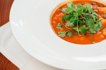 Red lentil soup on dark stone backgroud, top view
