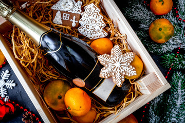 New Year's champagne and tangerines in box top view