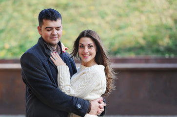 Fototapeta premium Portrait of happy young couple in love at the park.