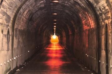 Fototapeta na wymiar The sun at the end of the tunnel in Banos de Agua Santa, Ecuador