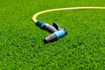 Watering equipment for garden on a grass.