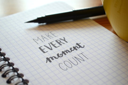 MAKE EVERY MOMENT COUNT hand-lettered in notebook