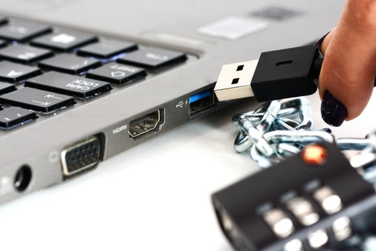 Secured network connection or IT security concept with notebook, chain and padlock 