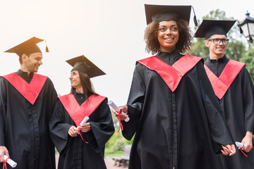 Joyful students celebrating their graduation from university